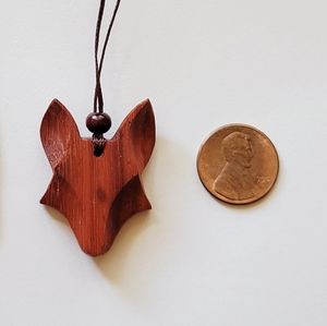 Wood wolf/fox pendant with adjustable cord